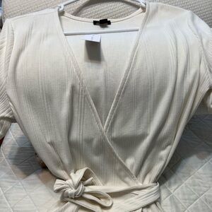 Short sleeve knit wrap top. New with tag.